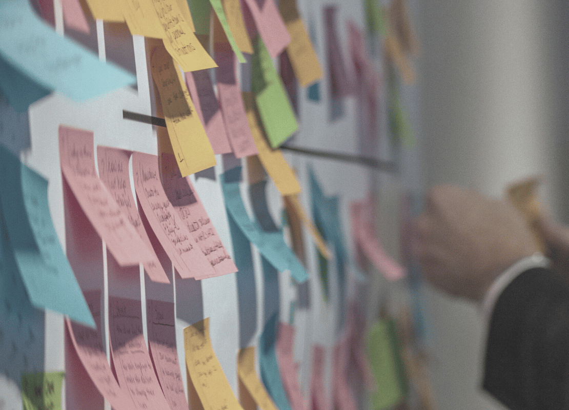 Communicating your priorities better with the 'rule of five'. Post-it notes on a wall.